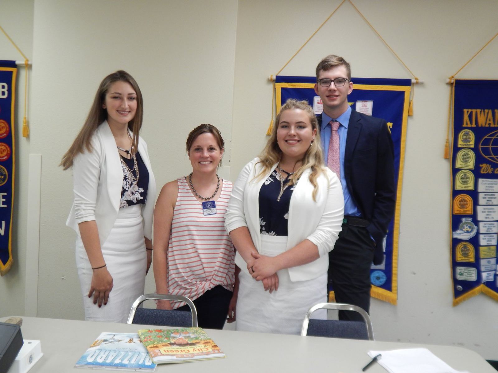 Four young adults at conference